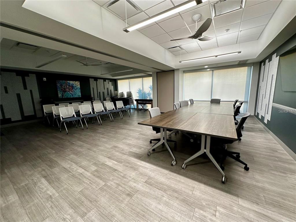 1100 South Belcher Road, Unit 406 Largo, FL 33771 - Photo 34 of 46 a outdoor space with lots of furniture and wooden floor