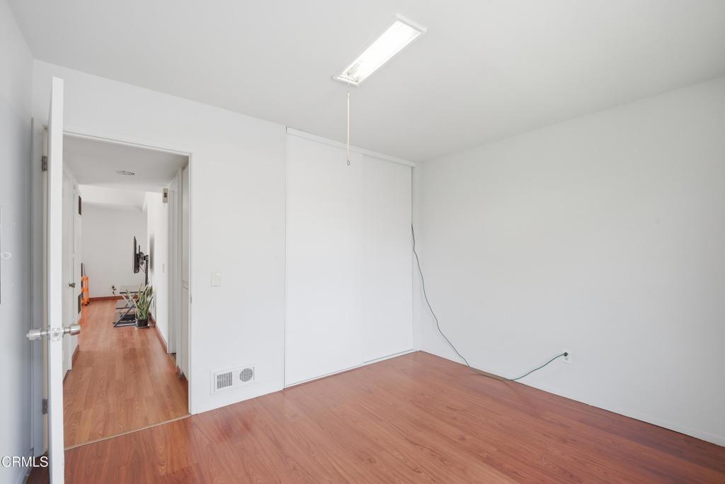 5154 Jefferson Square Oxnard, CA 93033 - Photo 20 of 23 a view of a room with wooden floor