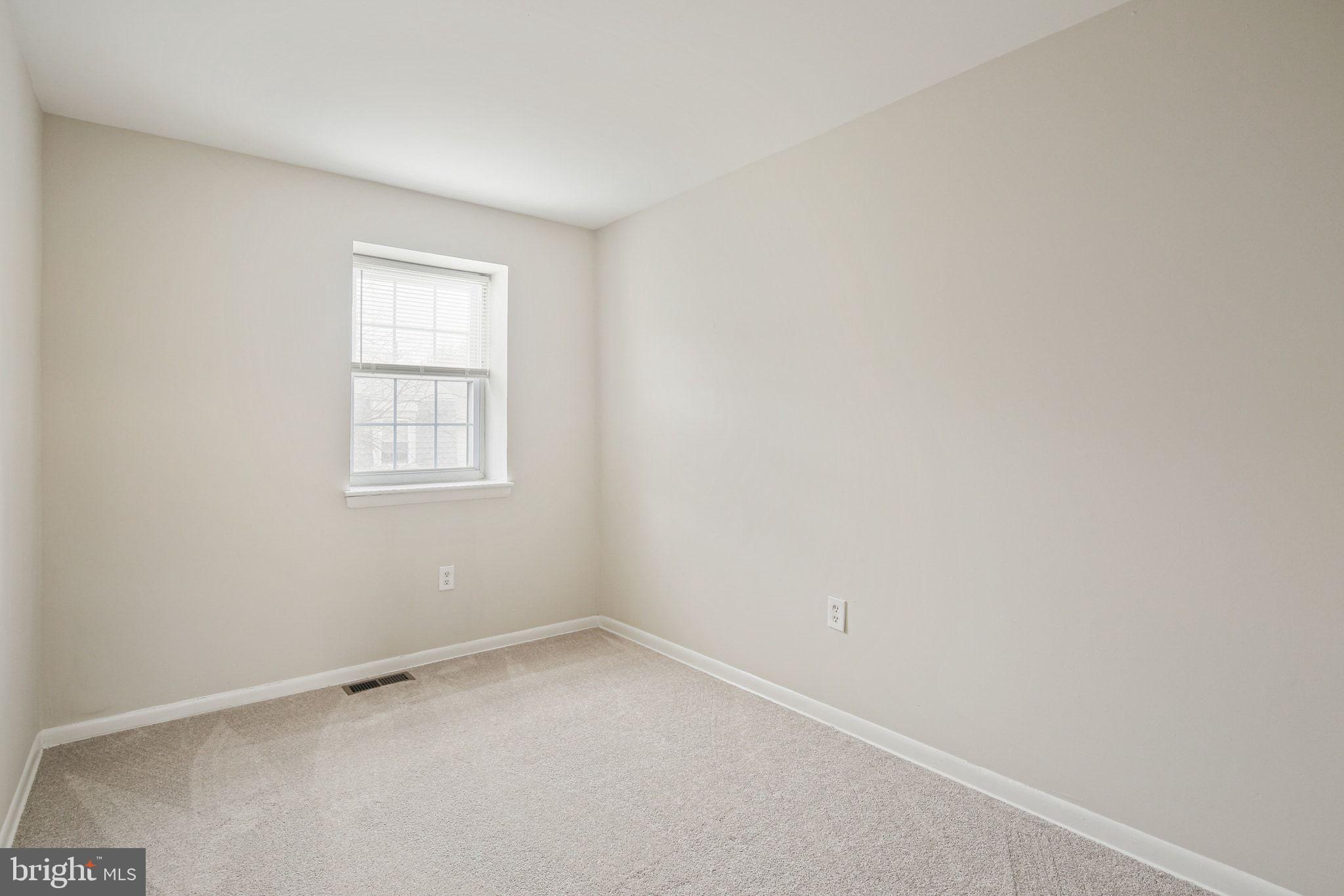 8209 Stewarton Court Severn, MD 21144 - Photo 23 of 34 an empty room with a window