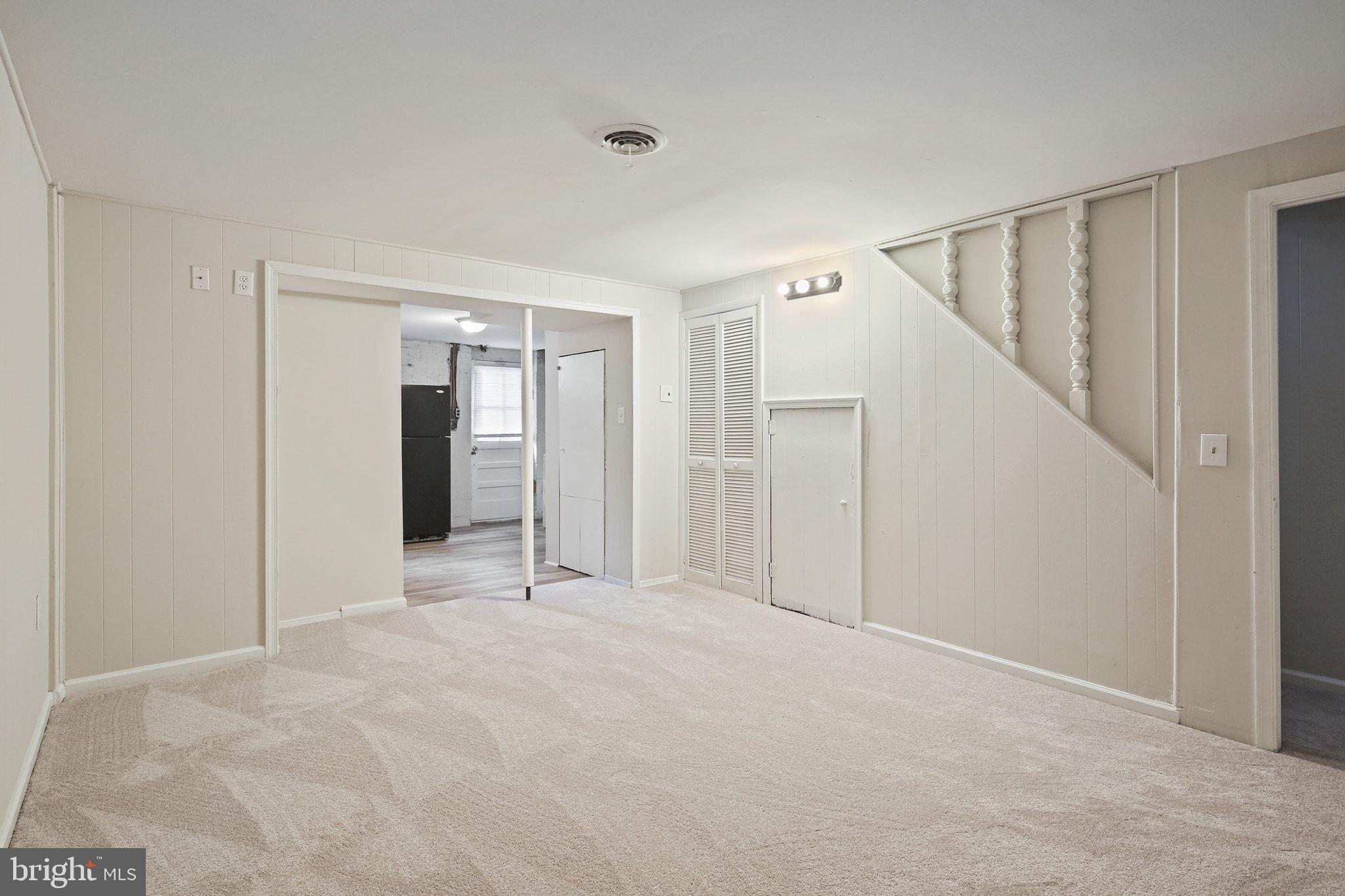 8209 Stewarton Court Severn, MD 21144 - Photo 27 of 34 a view of an empty room with stairs