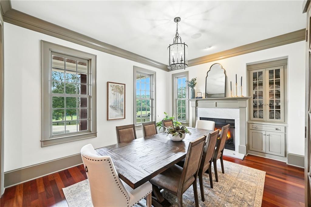 2229 Long Road Ball Ground, GA 30107 - Photo 15 of 88 a view of a dining room with furniture window and wooden floor