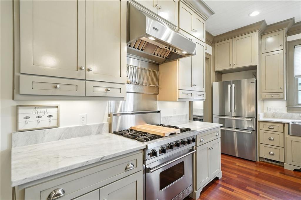 2229 Long Road Ball Ground, GA 30107 - Photo 19 of 88 a kitchen with stainless steel appliances granite countertop a sink a stove and refrigerator