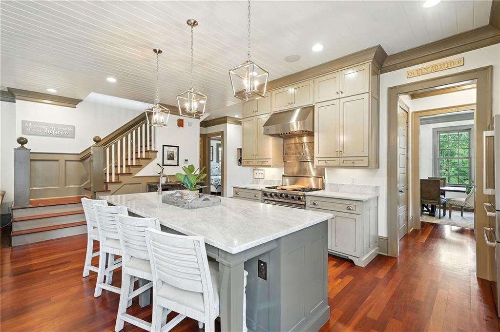 2229 Long Road Ball Ground, GA 30107 - Photo 23 of 88 a kitchen with a table chairs and wooden floor