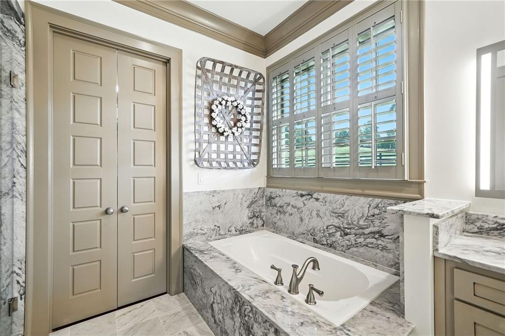 2229 Long Road Ball Ground, GA 30107 - Photo 34 of 88 a bath tub sitting in a bathroom next to a window