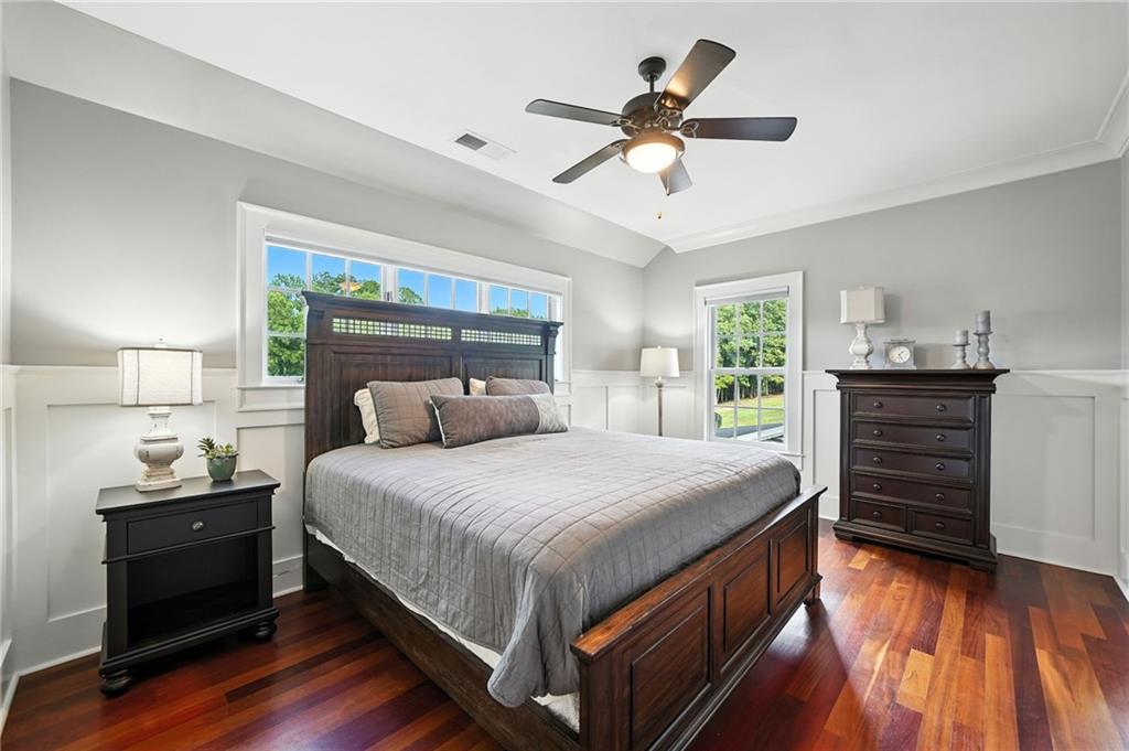 2229 Long Road Ball Ground, GA 30107 - Photo 41 of 88 a bedroom with a bed and a chandelier