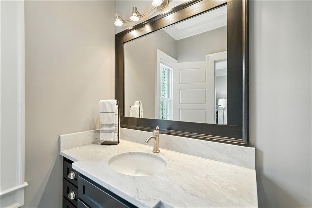 2229 Long Road Ball Ground, GA 30107 - Photo 42 of 88 a bathroom with a sink and a mirror
