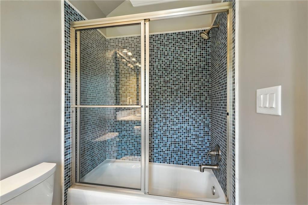 2229 Long Road Ball Ground, GA 30107 - Photo 43 of 88 a bathroom with a bathtub and a shower