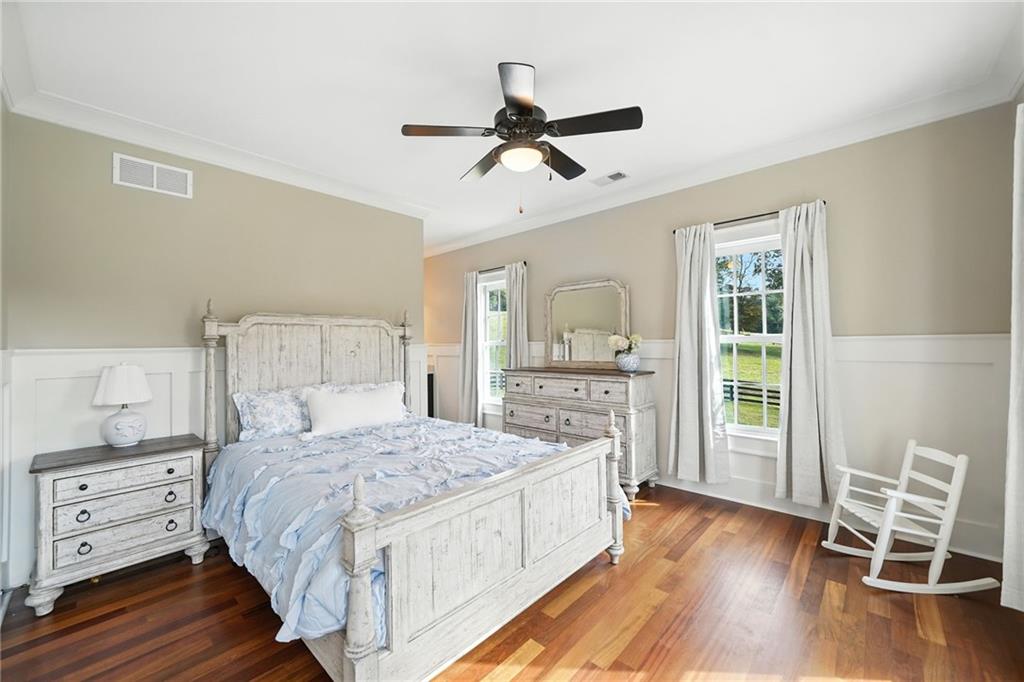 2229 Long Road Ball Ground, GA 30107 - Photo 44 of 88 a bedroom with a bed and wooden floor