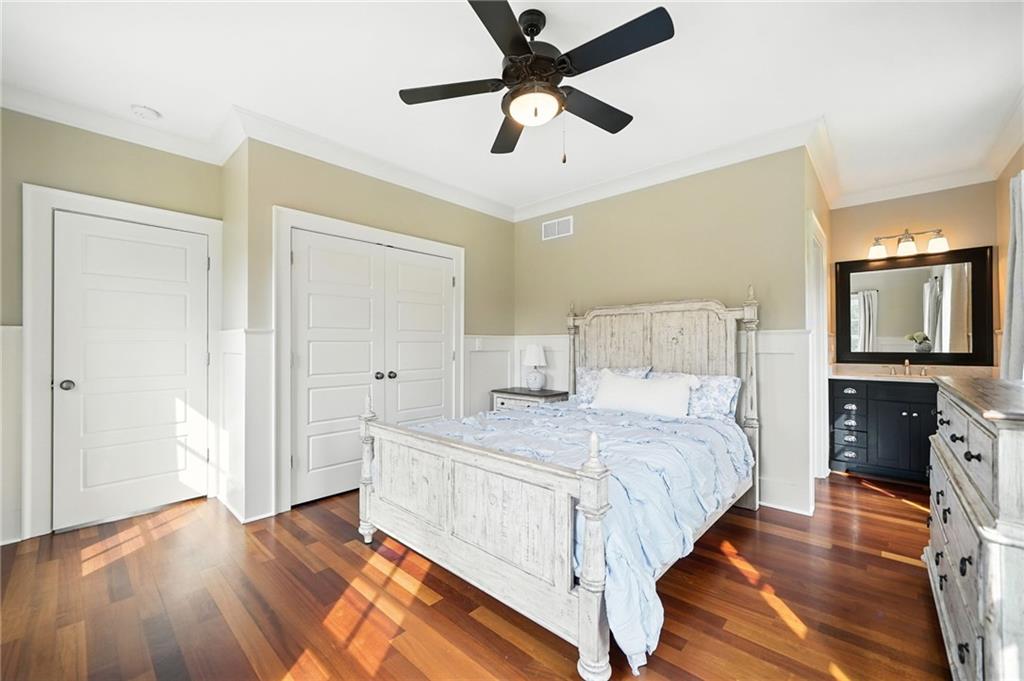 2229 Long Road Ball Ground, GA 30107 - Photo 45 of 88 a bedroom with a bed and a flat tv screen on dresser