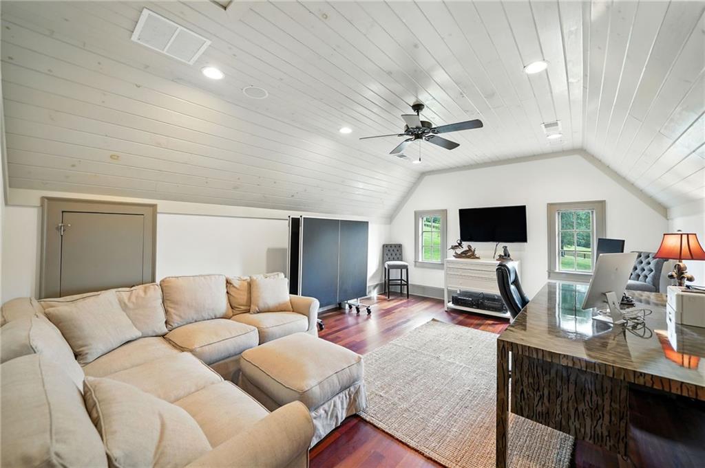 2229 Long Road Ball Ground, GA 30107 - Photo 51 of 88 a living room with furniture kitchen view and a flat screen tv