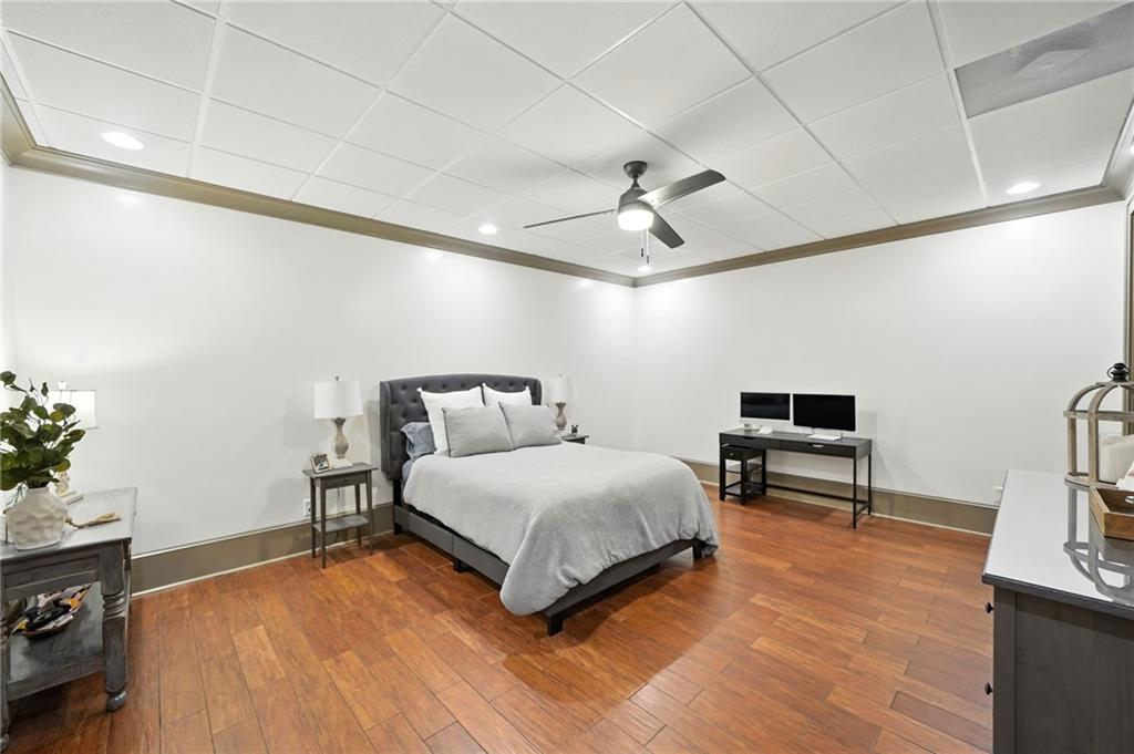 2229 Long Road Ball Ground, GA 30107 - Photo 57 of 88 a spacious bedroom with a bed and a flat screen tv
