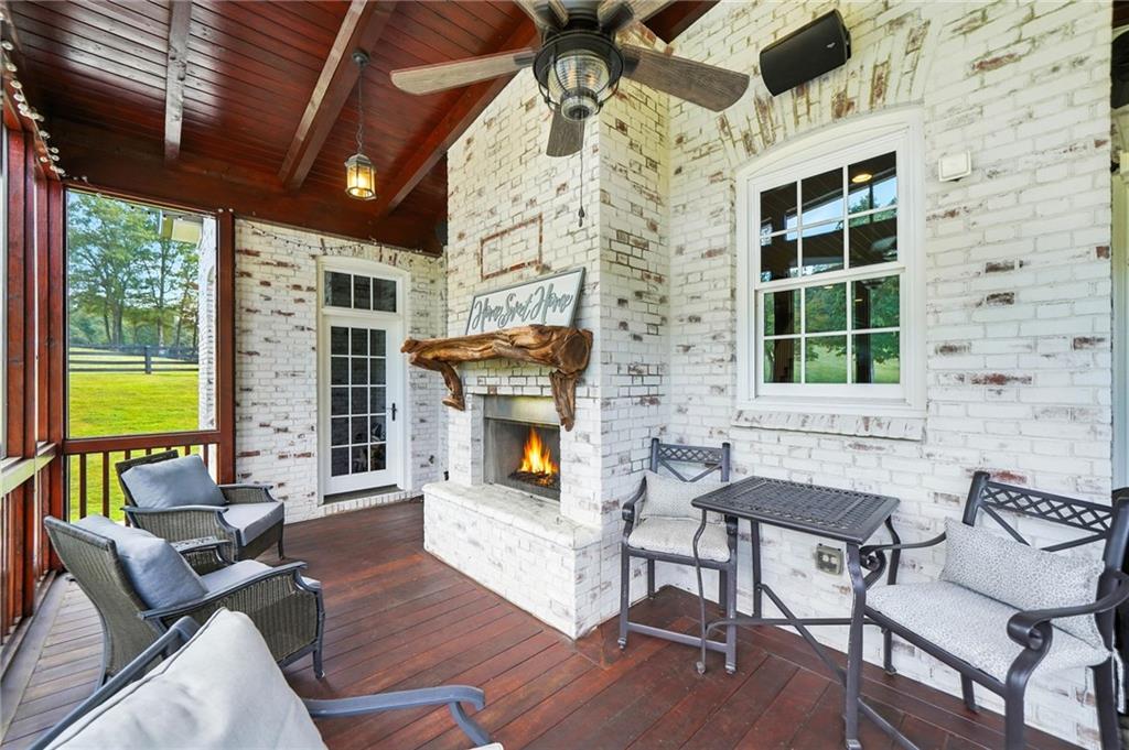 2229 Long Road Ball Ground, GA 30107 - Photo 61 of 88 a balcony with furniture and a fireplace