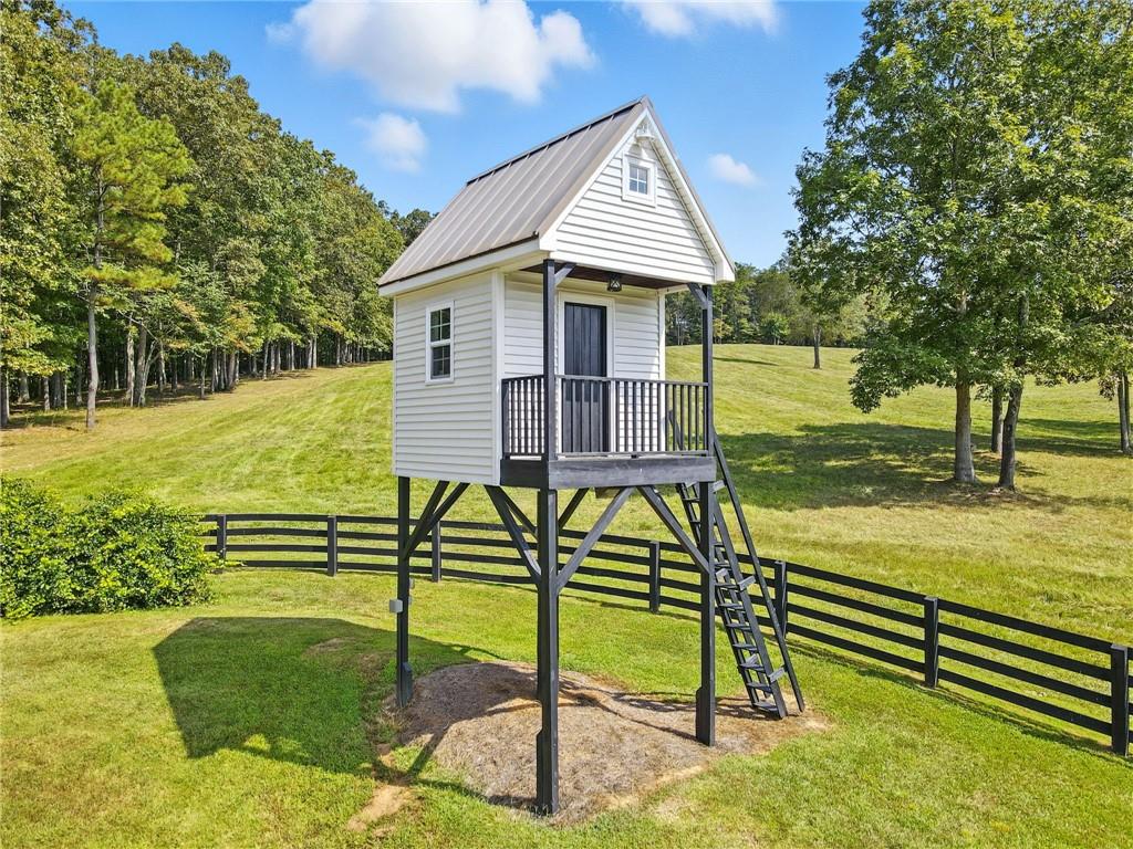 2229 Long Road Ball Ground, GA 30107 - Photo 77 of 88 a view of a house with backyard and sitting area