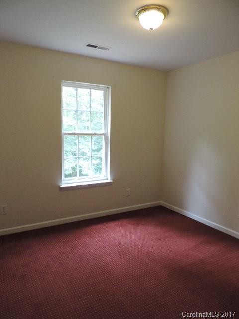 3726 Lake Road Charlotte, NC 28269 - Photo 13 of 18 an empty room with a window