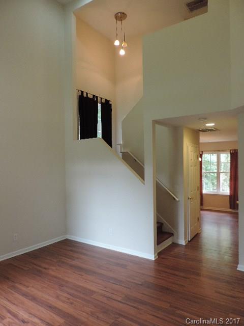 3726 Lake Road Charlotte, NC 28269 - Photo 17 of 18 wooden floor in an empty room with a window