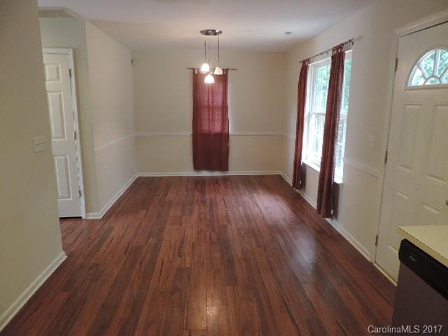 3726 Lake Road Charlotte, NC 28269 - Photo 4 of 18 wooden floor in an empty room with a window