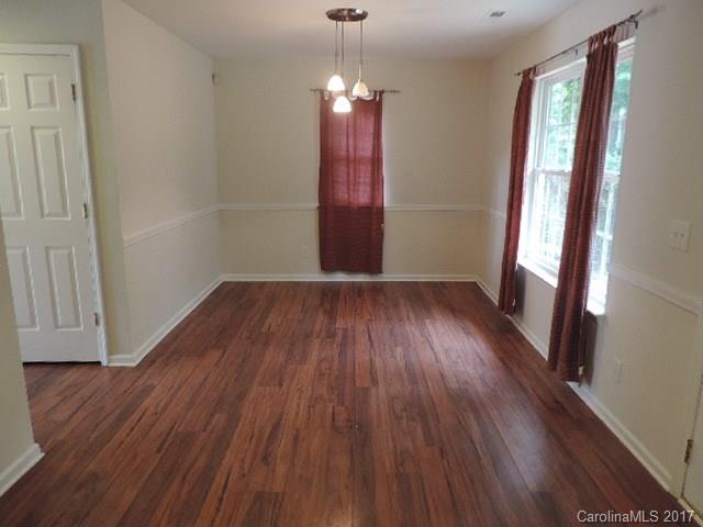 3726 Lake Road Charlotte, NC 28269 - Photo 6 of 18 wooden floor in an empty room with a window
