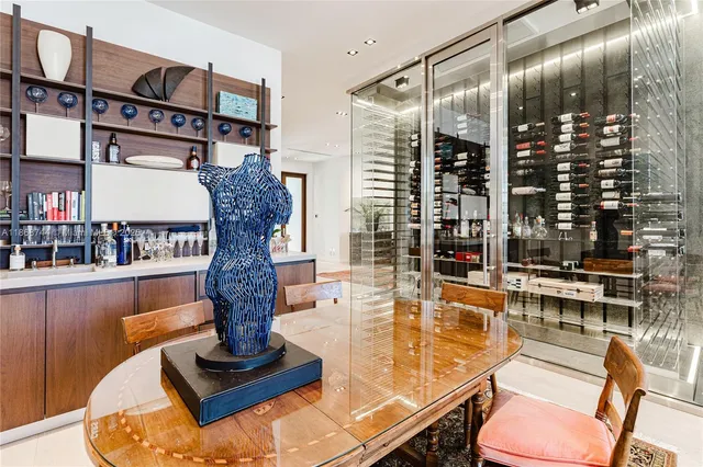 a bedroom with a bed mirror and window