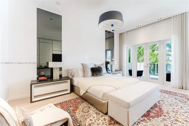 a view of a lake with boats and a cars parked in front of it