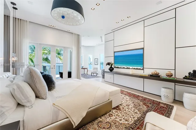 a view of a multi story residential apartment building and potted plants