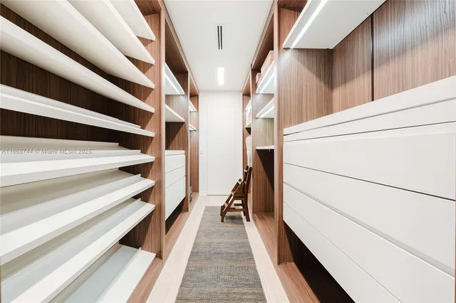 a bathroom with a tub and a mirror