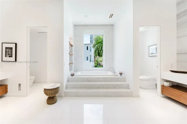 a bathroom with a bathtub and a sink