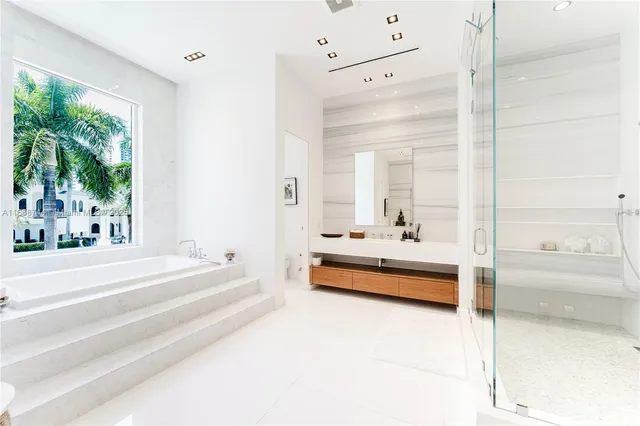 a bathroom with a tub and shower
