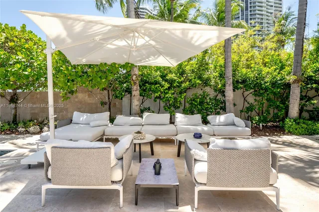 a front view of a house with swimming pool and porch