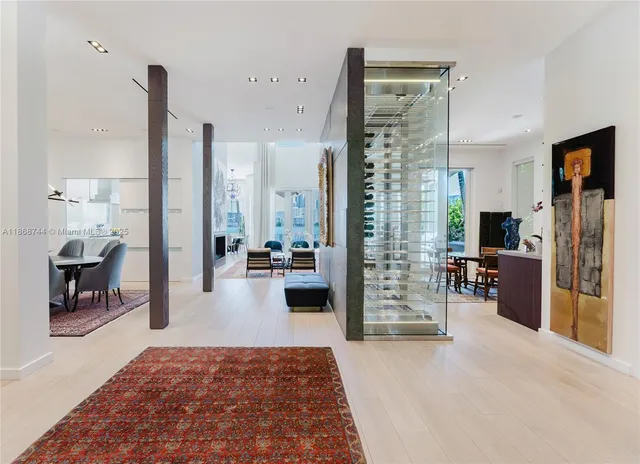 a view of a dining room with furniture wooden floor and a flat screen tv