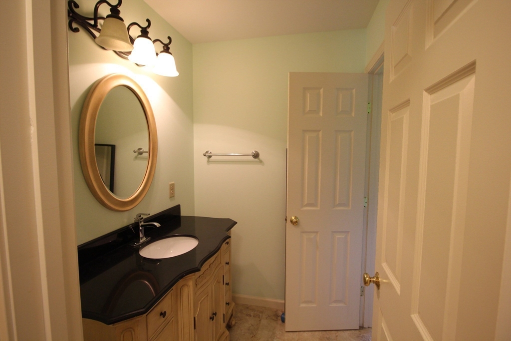 5 Gableview Lane Southwick, MA 01077 - Photo 37 of 41 a bathroom with a sink and a mirror