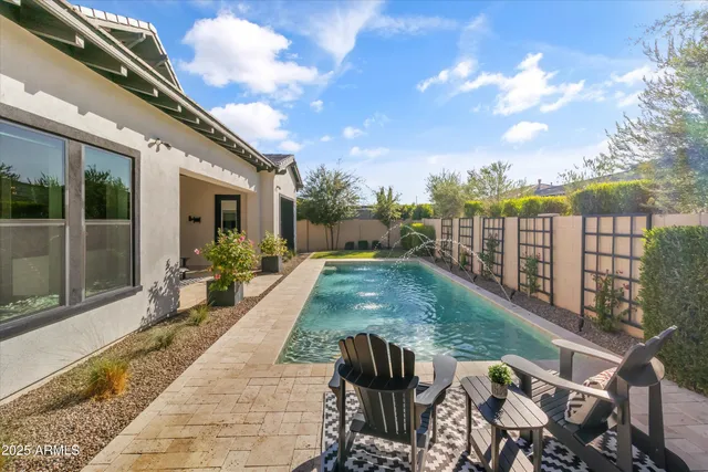 a view of a backyard with sitting area