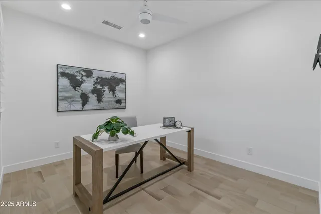 a view of a workspace with furniture