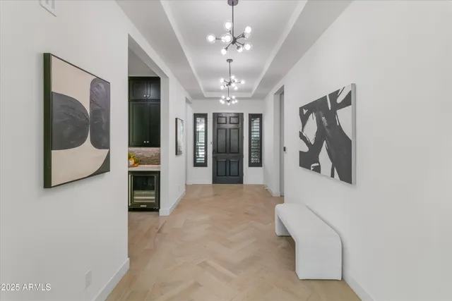a view of a hallway with a washer and dryer