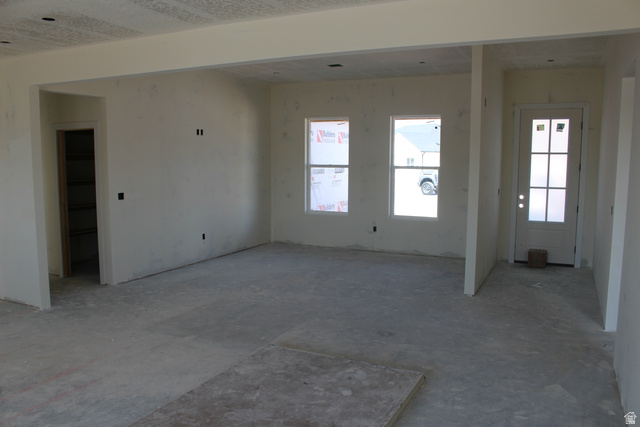 4933 East Remington Road Cedar City, UT 84721 - Photo 10 of 33 Interior space featuring unadorned walls and unfinished concrete flooring