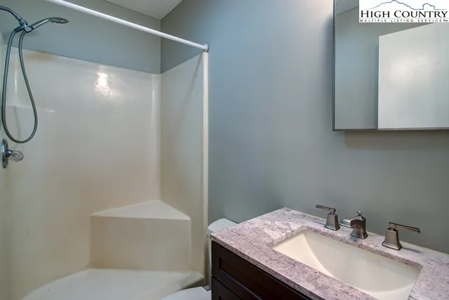 a bathroom with a sink toilet and vanity