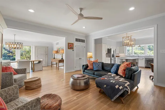 a living room with furniture or couch and a large window