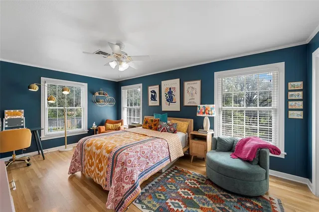 a bedroom with a bed and a couch