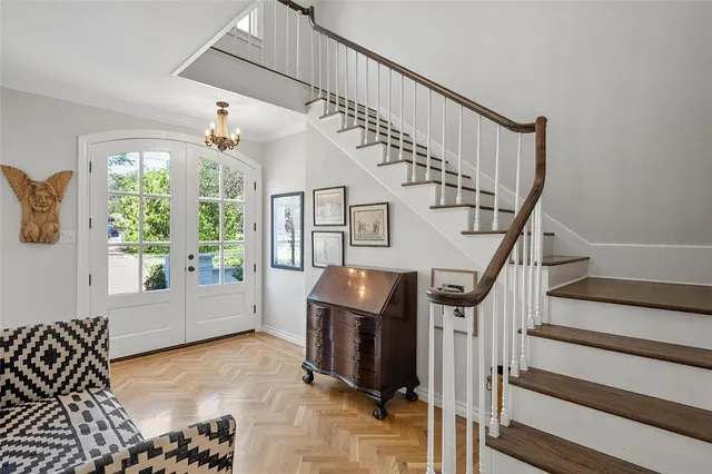 a view of entryway and hall with wooden floor