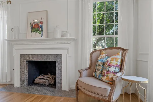 a living room with furniture and a fireplace