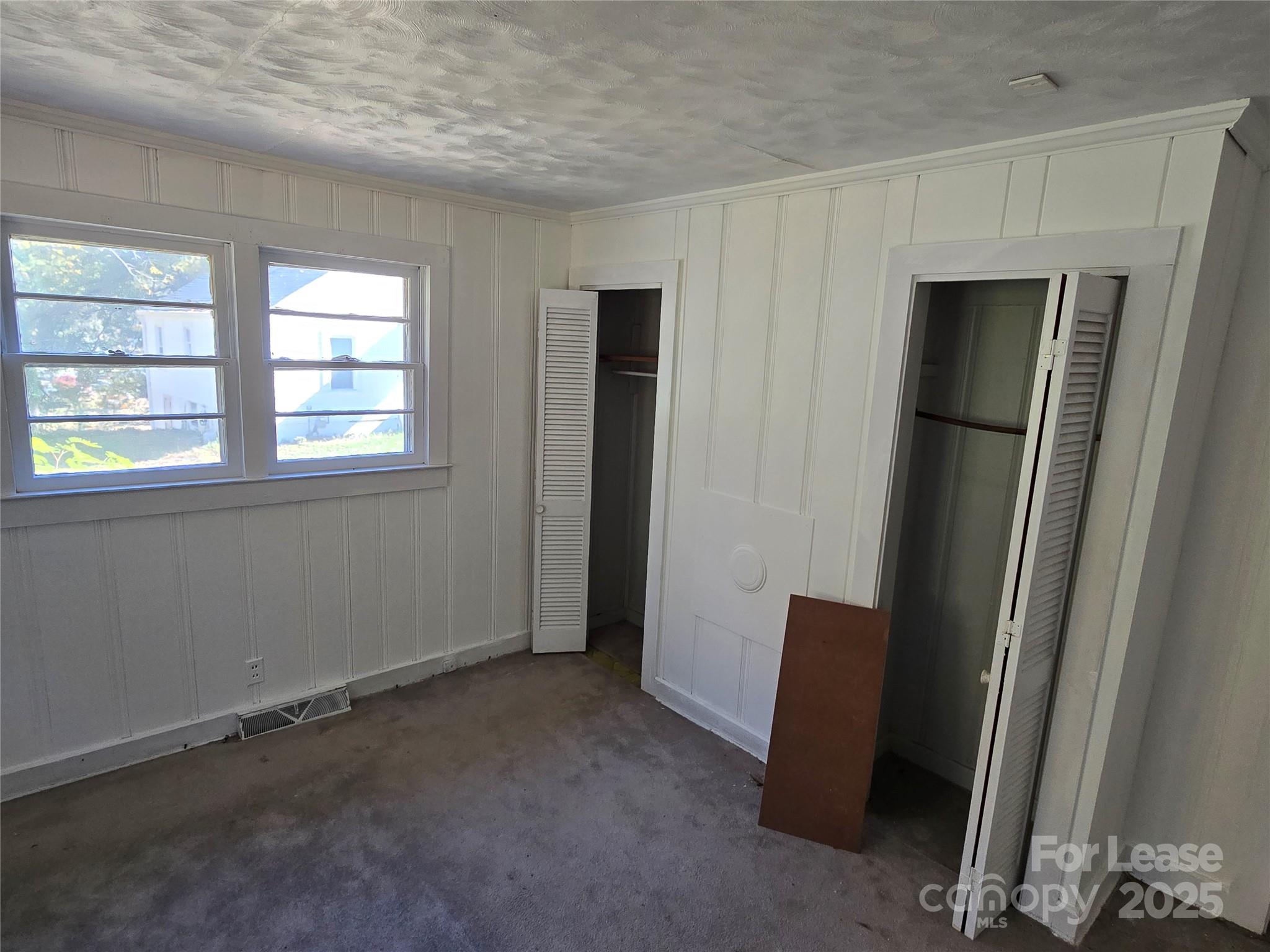 1233 East Cannon Avenue Albemarle, NC 28001 - Photo 5 of 13 an empty room with windows