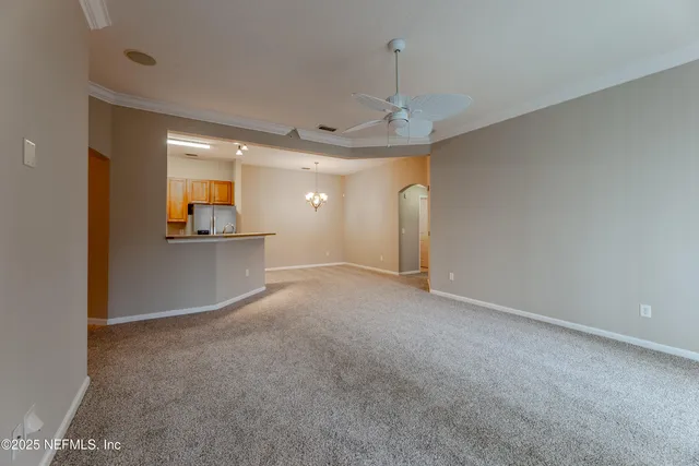 a view of a kitchen with a sink and a cabinet