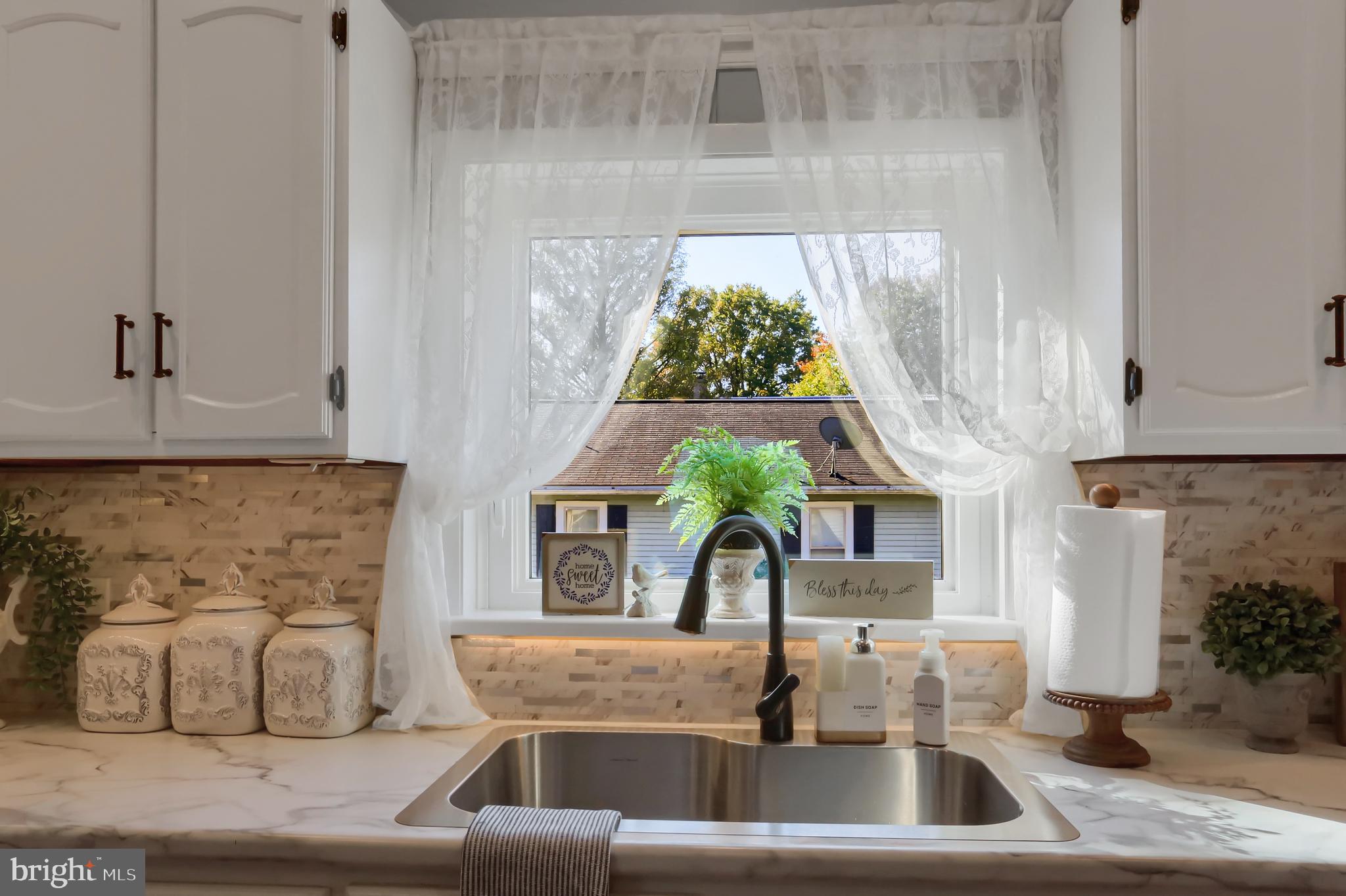 3209 Peters Mountain Road Halifax, PA 17032 - Photo 14 of 56 a kitchen with a sink and potted plant