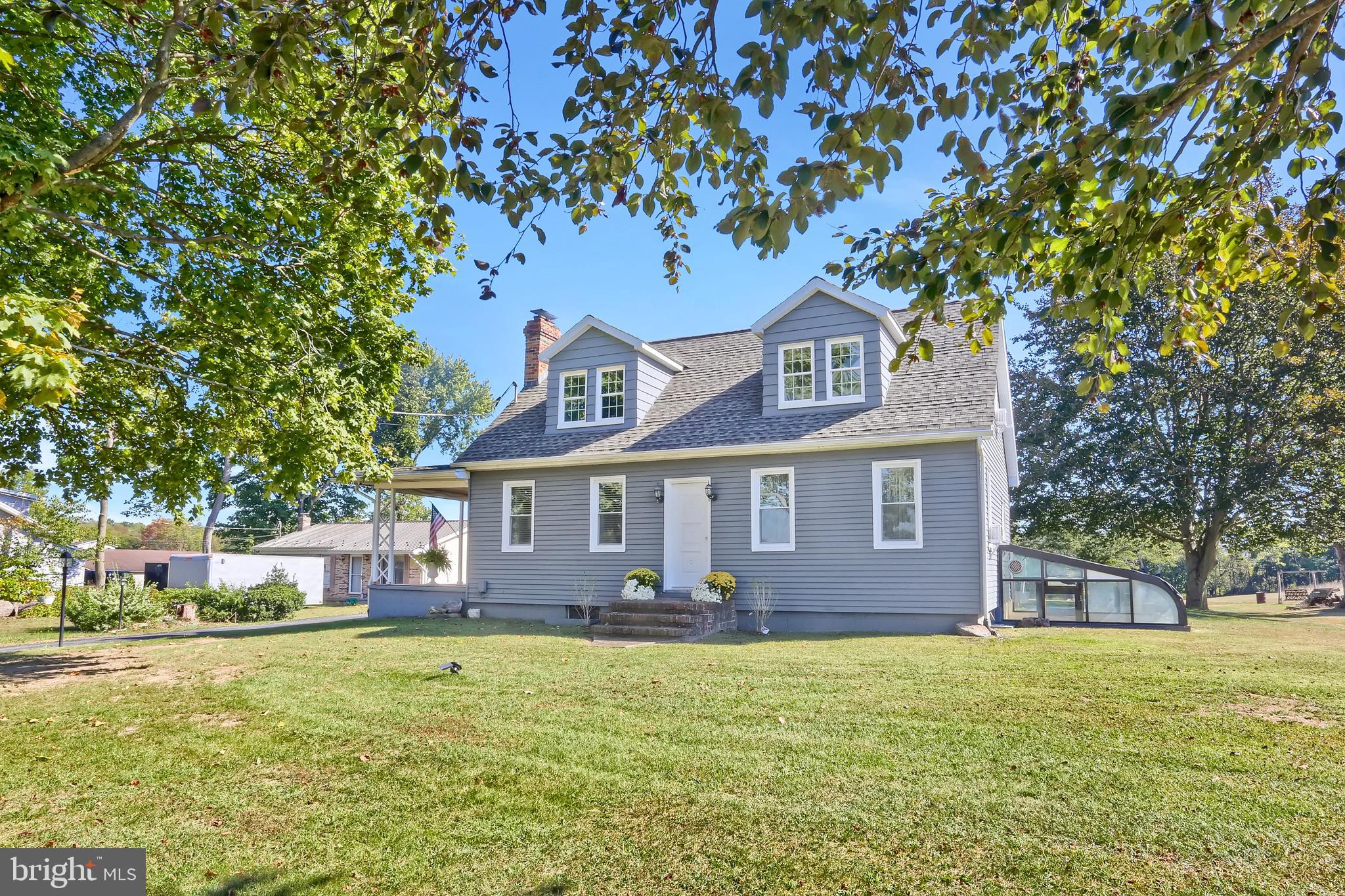 3209 Peters Mountain Road Halifax, PA 17032 - Photo 2 of 56 a front view of a house with a yard
