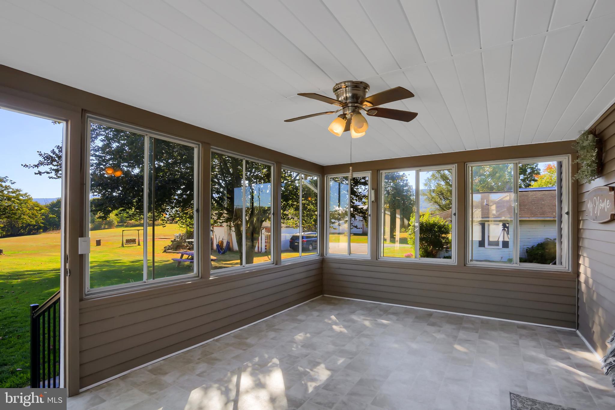 3209 Peters Mountain Road Halifax, PA 17032 - Photo 21 of 56 a view of an entryway with a floor to ceiling window next to a yard