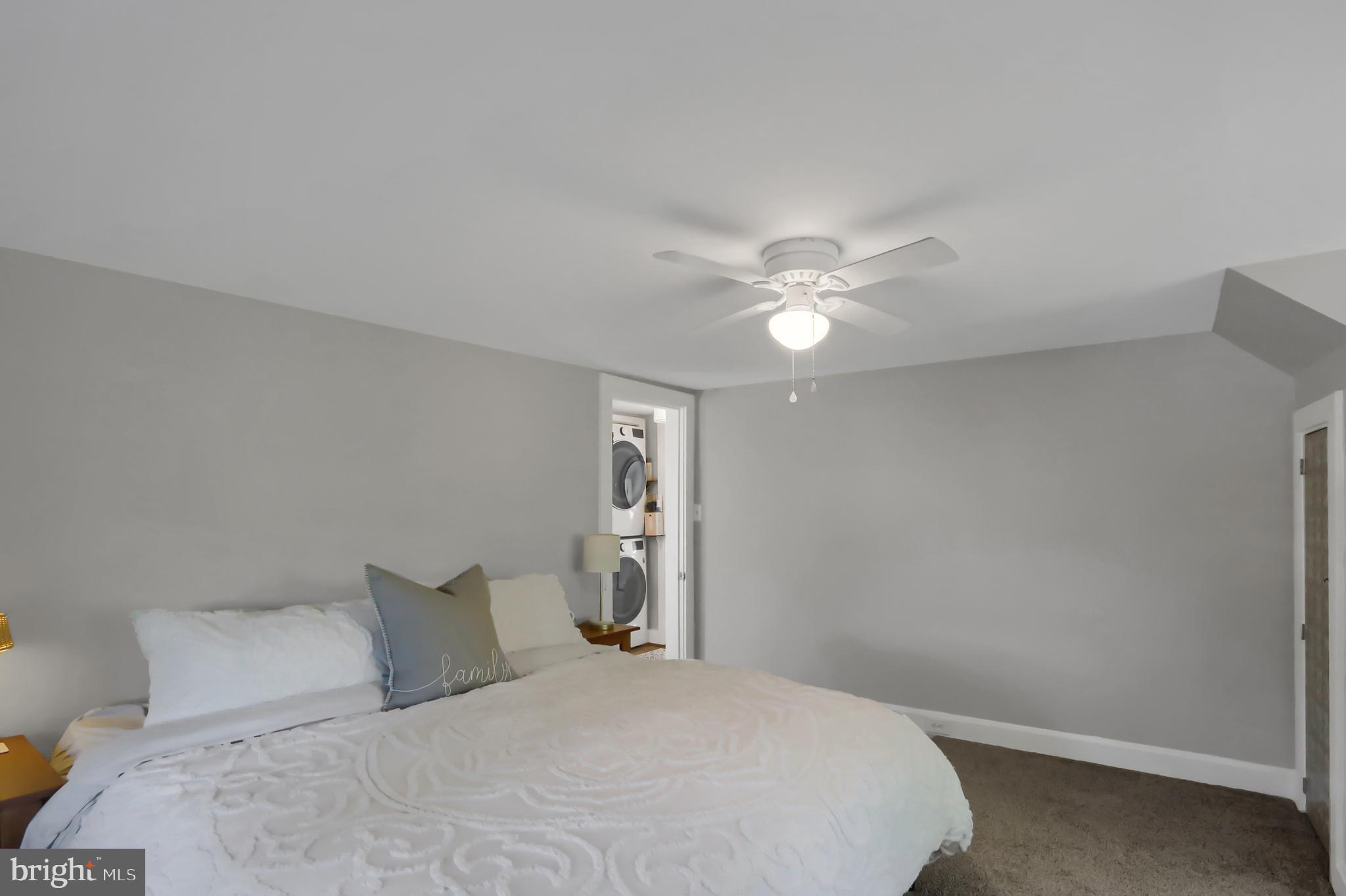 3209 Peters Mountain Road Halifax, PA 17032 - Photo 28 of 56 a bedroom with a large bed and a chandelier