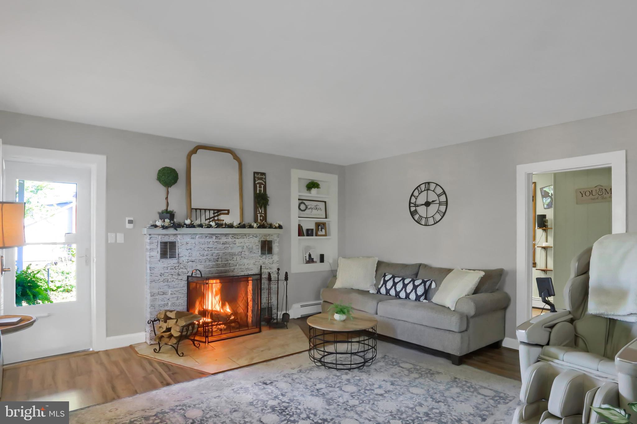 3209 Peters Mountain Road Halifax, PA 17032 - Photo 4 of 56 a living room with furniture and a fireplace