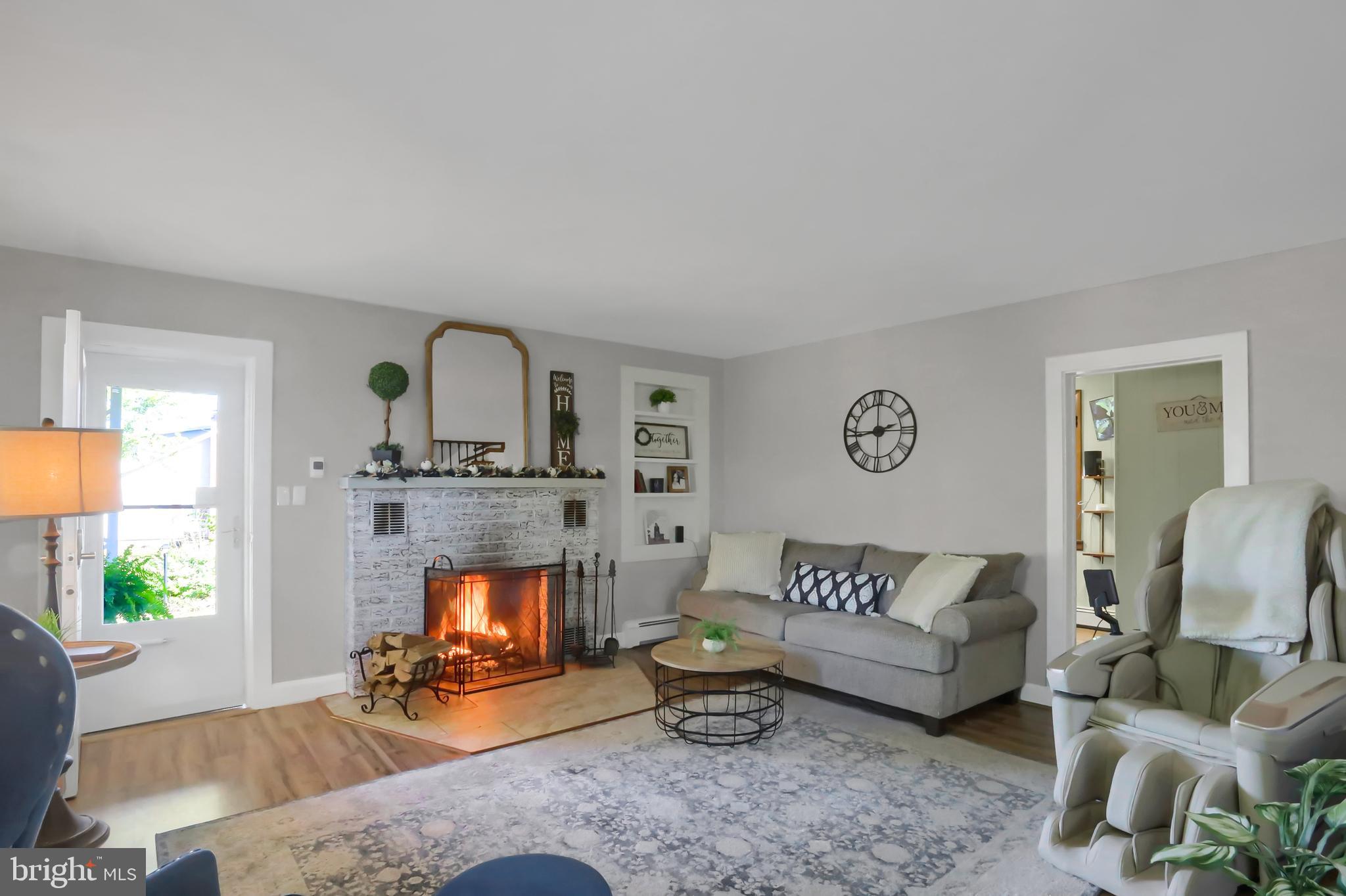 3209 Peters Mountain Road Halifax, PA 17032 - Photo 5 of 56 a living room with furniture and a fireplace