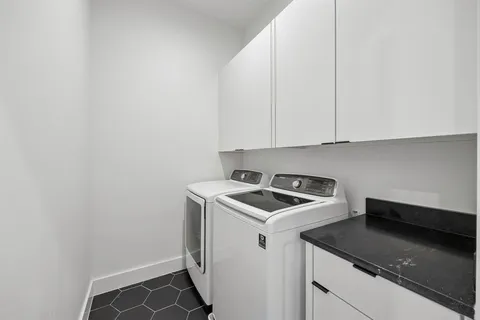 a kitchen that has a sink and cabinets