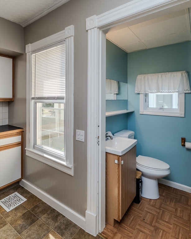 50 Duryea Street Springfield, MA 01104 - Photo 14 of 29 a bathroom with a toilet sink and mirror