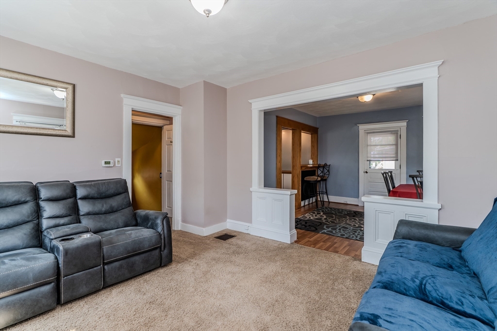 50 Duryea Street Springfield, MA 01104 - Photo 5 of 29 a living room with furniture and a wooden floor